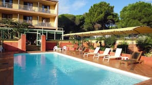 Seasonal outdoor pool, pool loungers