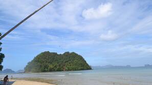 On the beach, sun loungers, beach umbrellas