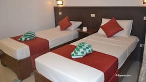 Desk, iron/ironing board, bed sheets