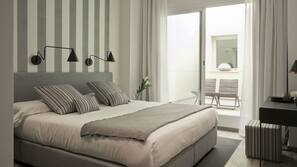 Ropa de cama de alta calidad, minibar, caja fuerte y escritorio
