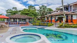 Outdoor pool, open 10:00 AM to 10:30 PM, pool umbrellas