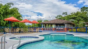 Outdoor pool, open 10:00 AM to 10:30 PM, pool umbrellas