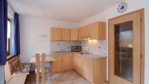 Fridge, stovetop, cookware/dishes/utensils