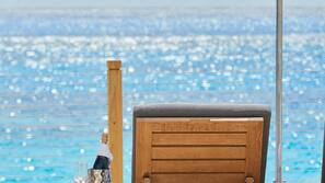 Private beach, white sand, sun loungers, beach umbrellas