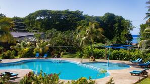 Outdoor pool, pool umbrellas, sun loungers
