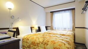 In-room safe, desk, laptop workspace, bed sheets