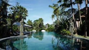 Outdoor pool, open 8:00 AM to 8:00 PM, pool umbrellas, pool loungers