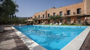 Seasonal outdoor pool, pool umbrellas, pool loungers