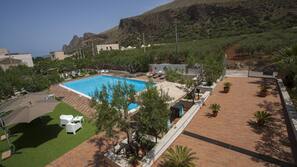 Seasonal outdoor pool, pool umbrellas, pool loungers