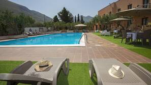 Seasonal outdoor pool, pool umbrellas, pool loungers