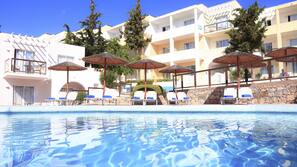 Indoor pool, outdoor pool, pool umbrellas, pool loungers