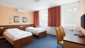 Premium bedding, pillowtop beds, desk, blackout drapes
