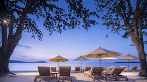 On the beach, sun loungers, beach umbrellas, beach towels