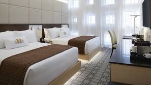 Premium bedding, down comforters, memory foam beds, minibar