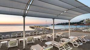 On the beach, free beach shuttle, beach cabanas, sun-loungers