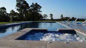 Seasonal outdoor pool, open 7 AM to 10:30 PM, pool umbrellas