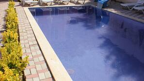 Outdoor pool, pool umbrellas, pool loungers
