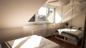 1 slaapkamer, een strijkplank/strijkijzer, babybedden, extra bedden