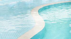 Outdoor pool, pool umbrellas, lifeguards on site