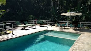 Outdoor pool, pool umbrellas, sun loungers