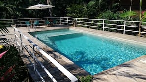 Outdoor pool, pool umbrellas, sun loungers