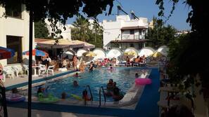 Seasonal outdoor pool, pool umbrellas, pool loungers