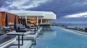 2 outdoor pools, pool umbrellas, pool loungers