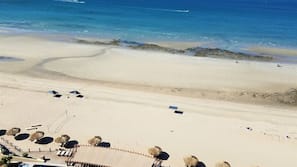 On the beach, sun loungers
