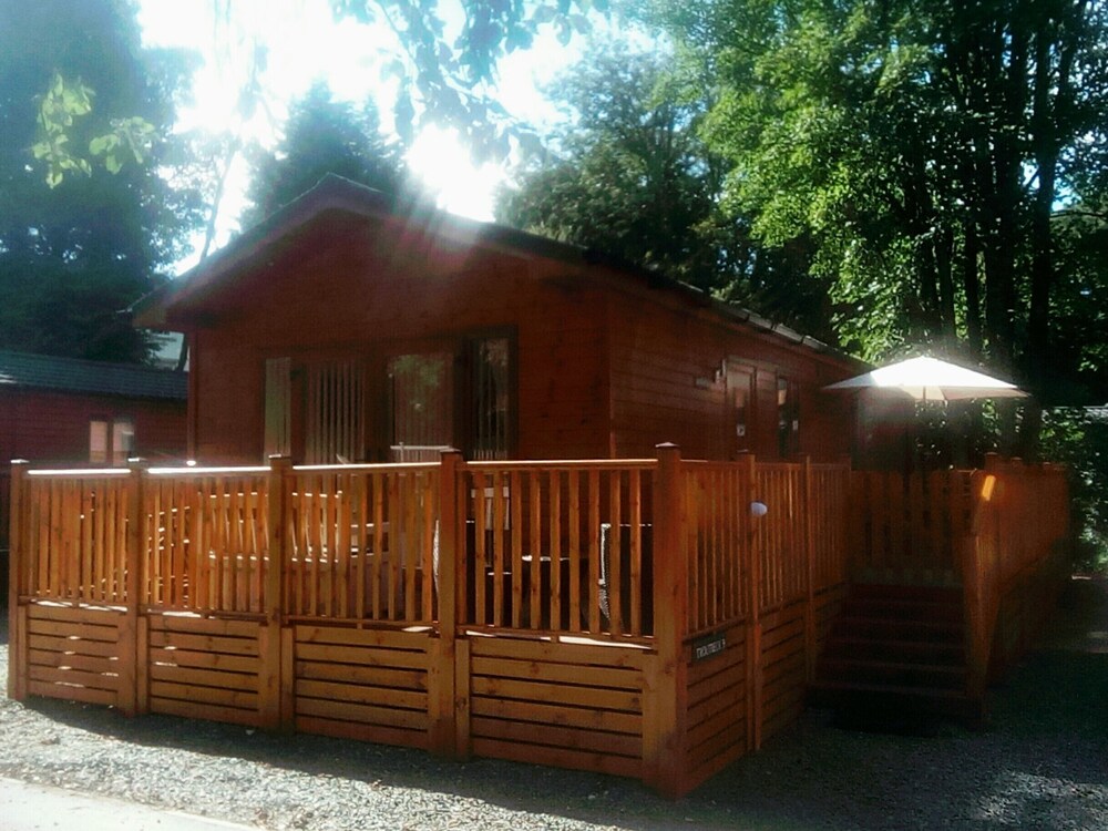 Log Cabin On Shores Of Lake Windermere, Surrounded By Breathtaking