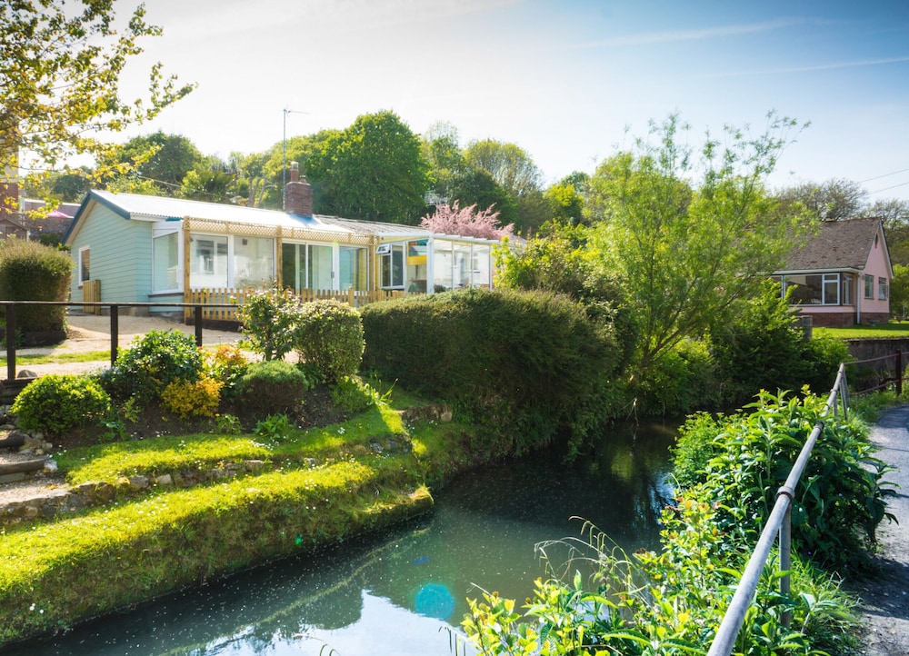 Homestead Lyme Regis Is A Cosy Riverside Cabin 10 Mins Walk From