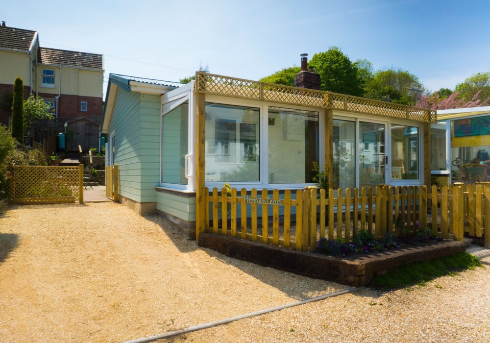 Homestead Lyme Regis Is A Cosy Riverside Cabin 10 Mins Walk From