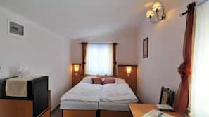 Allergitestade sängkläder, minibar och värdeförvaringsskåp på rummet