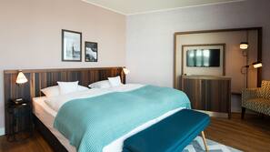Luxe beddengoed, een minibar, een kluis op de kamer, een bureau