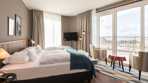 Luxe beddengoed, een minibar, een kluis op de kamer, een bureau