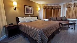 Premium bedding, desk, laptop workspace, blackout drapes