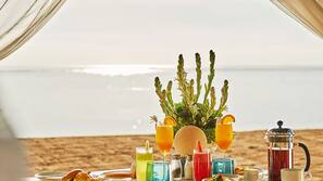 On the beach, sun-loungers, beach umbrellas, beach towels