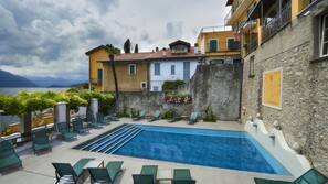 Seasonal outdoor pool, pool loungers