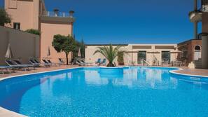 Seasonal outdoor pool, open 10 AM to 6 PM, pool umbrellas, pool loungers