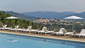 Indoor pool, outdoor pool, pool umbrellas, sun loungers