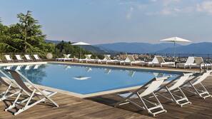 Indoor pool, outdoor pool, pool umbrellas, sun loungers