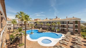 Indoor pool, outdoor pool, pool umbrellas, pool loungers
