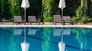Indoor pool, outdoor pool, pool umbrellas