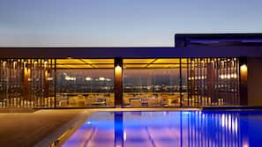 Seasonal outdoor pool, pool umbrellas, pool loungers