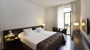 Ropa de cama de alta calidad, minibar, caja fuerte y escritorio