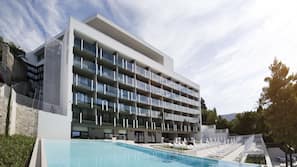 Indoor pool, outdoor pool, pool umbrellas, pool loungers
