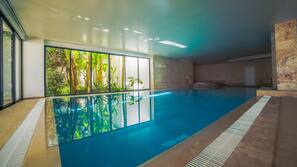 Indoor pool, outdoor pool, pool umbrellas, pool loungers