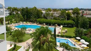 Indoor pool, outdoor pool, pool umbrellas, pool loungers