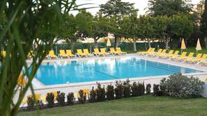 Indoor pool, outdoor pool, pool umbrellas, pool loungers
