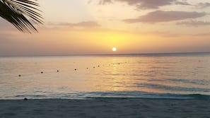 Private beach, white sand, sun loungers, beach bar