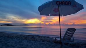 On the beach, sun-loungers, beach umbrellas, beach towels